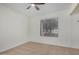 Light filled bedroom with neutral carpet, ceiling fan, and bright window at 8201 W Tuckey Ln, Glendale, AZ 85303