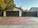 Charming home featuring a spacious driveway and a well-maintained front yard at 8201 W Tuckey Ln, Glendale, AZ 85303
