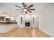 Inviting living area with hardwood floors, fireplace, and modern lighting fixtures at 8201 W Tuckey Ln, Glendale, AZ 85303