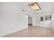 The large living room showcases tile flooring and a unique stained glass ceiling light at 8201 W Tuckey Ln, Glendale, AZ 85303