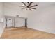 Spacious living area with high ceilings, hardwood floors, and stylish front door at 8201 W Tuckey Ln, Glendale, AZ 85303