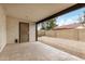 A covered back patio showcases decorative concrete and a low-maintenance gravel yard at 8201 W Tuckey Ln, Glendale, AZ 85303