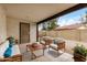 Cozy covered patio with comfortable seating, perfect for outdoor relaxation and enjoying the fresh air at 8201 W Tuckey Ln, Glendale, AZ 85303