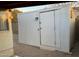 View of an outdoor shed with a white door, providing storage space in the backyard at 8201 W Tuckey Ln, Glendale, AZ 85303