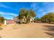 A spacious property with mature shade trees and a two-story home at 8310 W Daley Ln, Peoria, AZ 85383