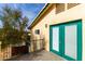 Balcony with green railing and entrance with sliding glass doors at 8310 W Daley Ln, Peoria, AZ 85383