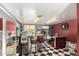 Retro themed bar area with checkered flooring, diner style seating, and vintage decor at 8310 W Daley Ln, Peoria, AZ 85383