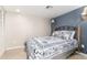 Cozy bedroom with decorative bed frame, custom wall lamps, and neutral paint palette at 8310 W Daley Ln, Peoria, AZ 85383