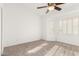 Bright bedroom with carpet and window shutters allowing in natural light at 8310 W Daley Ln, Peoria, AZ 85383