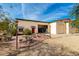 Outdoor dining space, plus garages and a rec room with garage doors at 8310 W Daley Ln, Peoria, AZ 85383