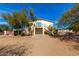 Exterior view of a house with a balcony, patio, and staircase at 8310 W Daley Ln, Peoria, AZ 85383