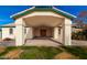 Covered entryway with brick floor and support columns for visitors or convenient parking at 8310 W Daley Ln, Peoria, AZ 85383