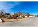 Expansive desert landscape featuring a long drive to the residence at 8310 W Daley Ln, Peoria, AZ 85383
