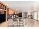 Kitchen area featuring granite countertops, stainless steel appliances, and counter seating at 8310 W Daley Ln, Peoria, AZ 85383