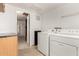 Laundry room with washer, dryer, and storage cabinet at 8310 W Daley Ln, Peoria, AZ 85383