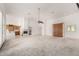 Expansive living room featuring a fireplace and access to the kitchen area at 8310 W Daley Ln, Peoria, AZ 85383