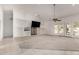 Large living room with carpet, built-in shelving, and French doors at 8310 W Daley Ln, Peoria, AZ 85383