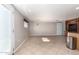 Spacious living room with tile floors, neutral walls, and walkout patio access at 8310 W Daley Ln, Peoria, AZ 85383
