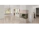 Cozy breakfast nook off kitchen with decorative fireplace and tile floors at 8310 W Daley Ln, Peoria, AZ 85383