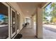 Covered outdoor patio with stone flooring,柱s, and serene views, perfect for entertaining and relaxation at 8310 W Daley Ln, Peoria, AZ 85383