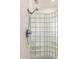 Close-up of a glass block walk-in shower, featuring a mounted shower head at 8310 W Daley Ln, Peoria, AZ 85383