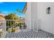 A charming balcony featuring an outdoor light fixture and patterned tile at 8607 N Farview Dr, Scottsdale, AZ 85258