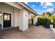 Home exterior featuring a paved entrance, decorative tile, and comfortable blue chairs at 8607 N Farview Dr, Scottsdale, AZ 85258