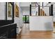 Welcoming hallway features hardwood floors, shiplap walls, and staircase, filled with natural light at 8607 N Farview Dr, Scottsdale, AZ 85258