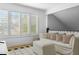 Bright living room featuring white furniture, shutters, and hardwood floors at 8607 N Farview Dr, Scottsdale, AZ 85258