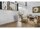 Bright and spacious living room with shiplap walls, staircase, hardwood floors, and comfortable seating at 8607 N Farview Dr, Scottsdale, AZ 85258