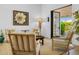 Cozy living room featuring hardwood floors, comfortable seating, and doors opening to the outside at 8607 N Farview Dr, Scottsdale, AZ 85258