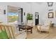 Inviting living room showcasing hardwood floors, comfortable seating, and doors to the outside at 8607 N Farview Dr, Scottsdale, AZ 85258