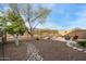 Relaxing backyard featuring desert landscaping, patio seating and privacy fence at 9878 E Rugged Mountain Dr, Gold Canyon, AZ 85118