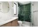 Stylish bathroom featuring a glass-door shower and modern vanity with marble countertops at 10220 N 66Th St, Paradise Valley, AZ 85253