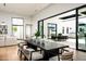 Modern dining room with large table, designer chairs and access to outdoor living at 10220 N 66Th St, Paradise Valley, AZ 85253