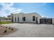 Modern home exterior with a paved driveway, sleek architectural design, and drought-resistant landscaping at 10220 N 66Th St, Paradise Valley, AZ 85253