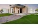 Stunning modern home with a unique exterior, lush landscaping, and inviting entrance at 10220 N 66Th St, Paradise Valley, AZ 85253