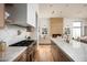 Modern kitchen with large island, marble countertops, and stainless steel appliances at 10220 N 66Th St, Paradise Valley, AZ 85253