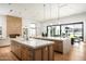 Open-concept kitchen with marble countertops, pendant lighting, and seamless access to outdoor living at 10220 N 66Th St, Paradise Valley, AZ 85253