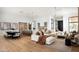 Bright open-concept living area with hardwood floors, neutral decor, and modern furnishings at 10220 N 66Th St, Paradise Valley, AZ 85253