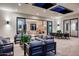 Outdoor covered patio with comfortable seating, a dining area, and open access to the indoors at 10220 N 66Th St, Paradise Valley, AZ 85253