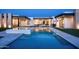 Tranquil swimming pool with modern architectural details and a view of the luxurious home at 10220 N 66Th St, Paradise Valley, AZ 85253