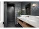 Stylish powder room featuring dark walls, unique lighting, and marble countertop sink at 10220 N 66Th St, Paradise Valley, AZ 85253