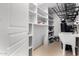 Pantry with floor to ceiling shelving with a large utility sink and open door at 11818 N Winchester Dr, Fountain Hills, AZ 85268