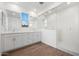 Bright bathroom with double vanity, white cabinets, and glass-enclosed shower at 1292 S 185Th Dr, Goodyear, AZ 85338