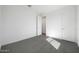 Bright bedroom with carpeted floors and a walk-in closet at 1292 S 185Th Dr, Goodyear, AZ 85338