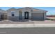 Charming single-story home featuring a well-manicured landscape and a two-car garage at 1292 S 185Th Dr, Goodyear, AZ 85338