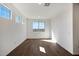 Bright flex space featuring wood-style floors and three windows at 1292 S 185Th Dr, Goodyear, AZ 85338