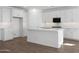 Bright kitchen with white cabinets, stainless steel appliances, and an island at 1292 S 185Th Dr, Goodyear, AZ 85338