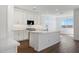 Bright kitchen features a large island, white cabinetry, and stainless steel appliances at 1292 S 185Th Dr, Goodyear, AZ 85338